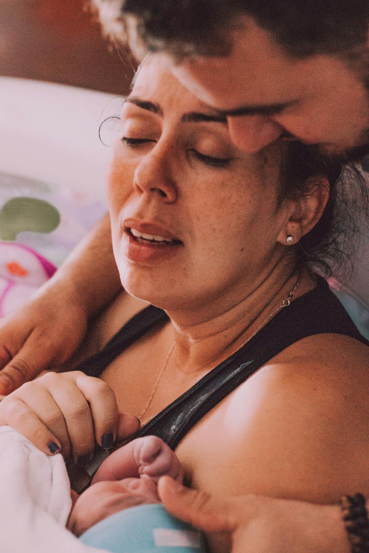 Woman holding a baby with a blurred background